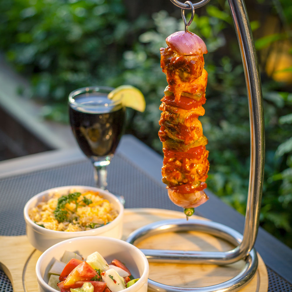 Chicken Brochette, Spicy Fried Rice, Greek Salad & Soft Drinks/Water